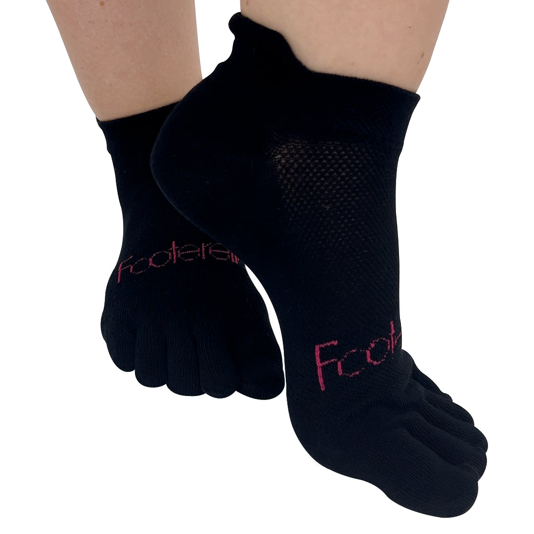 A pair of white low ankle toe socks with the brand 'FOOTERELLA' printed on the side, designed to be worn on the feet to promote straight toes and better toe alignment.