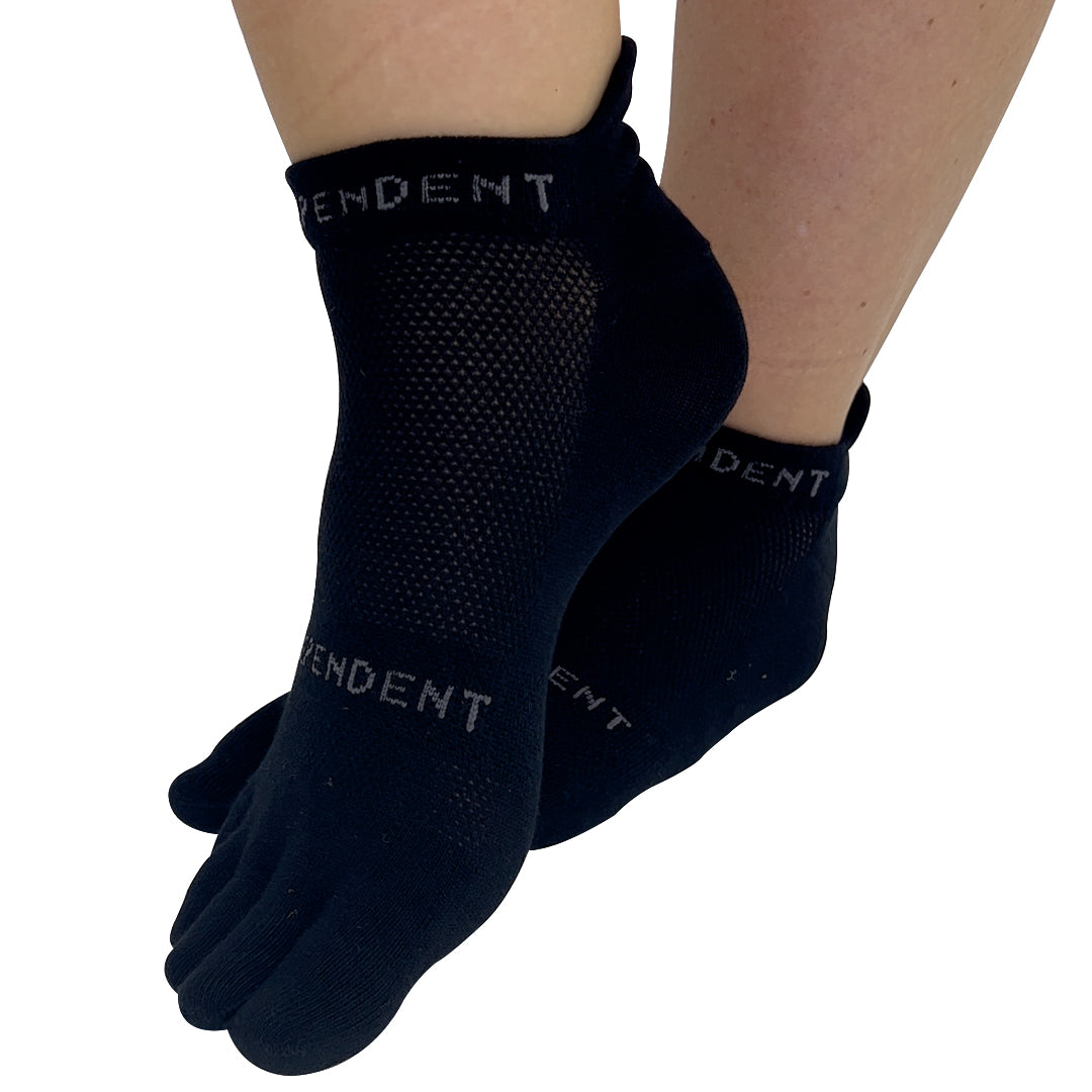 A pair of black low ankle independent toe socks designed to encourage straight toes and better toe alignment, with visible brand text on the side.