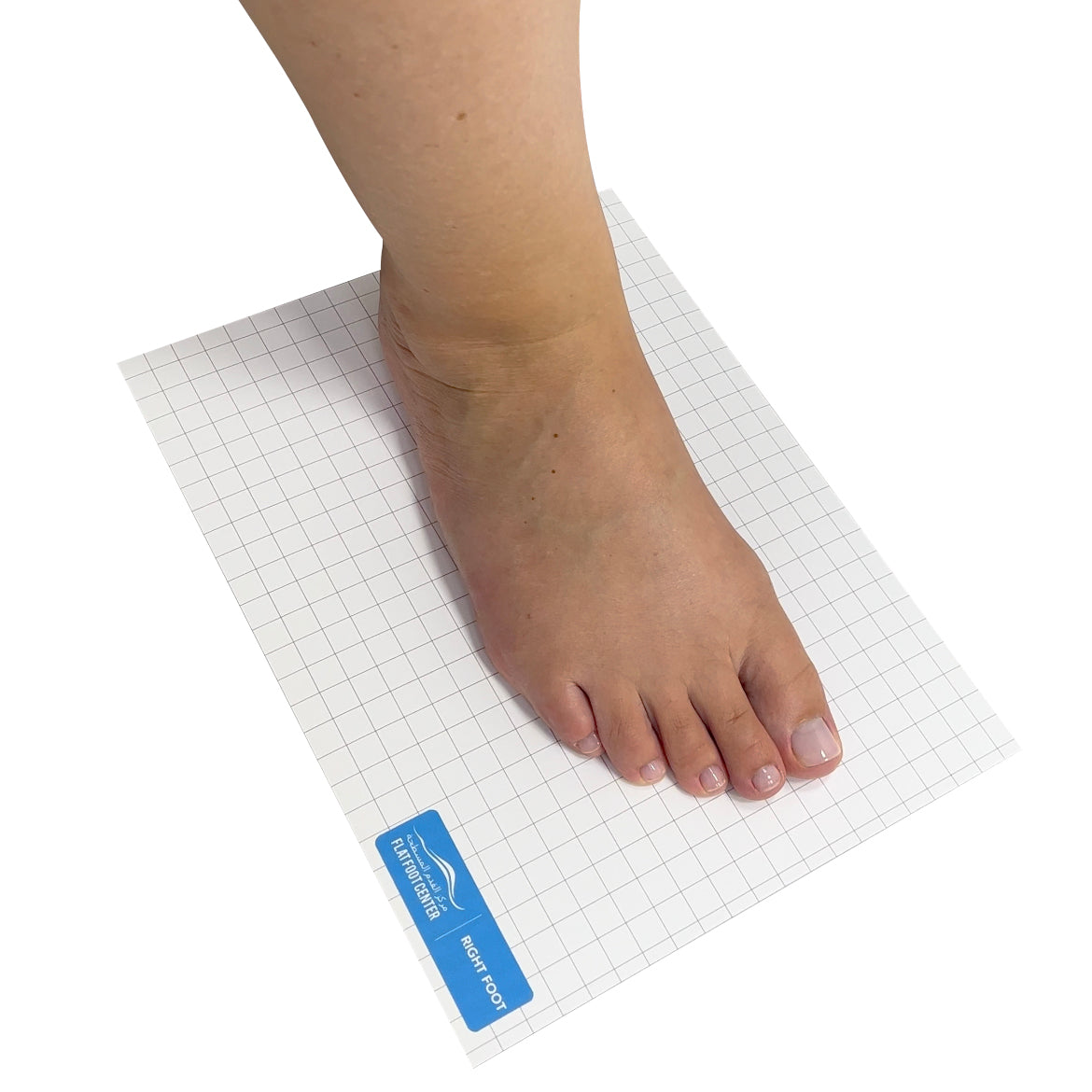 Right foot placed on a white grid line paper to capture the footprint, with the product's brand visible on the paper.