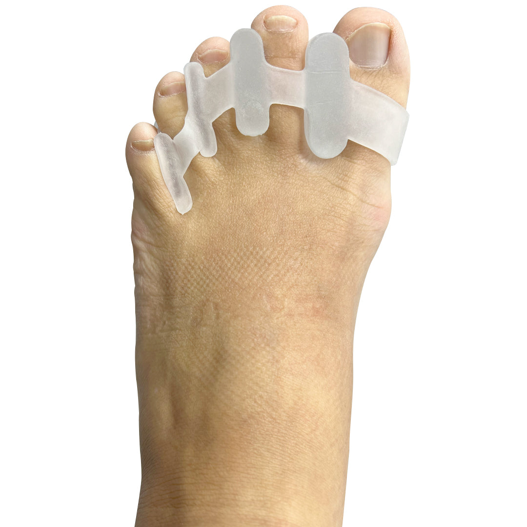 Silicone toe separators worn on foot to improve alignment and reduce plantar fasciitis pain