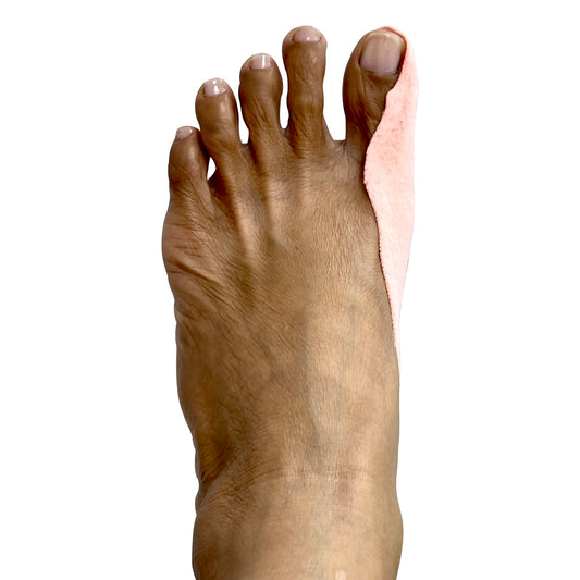 Sleeping bunion pad worn on foot to support big toe alignment